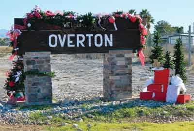 The Welcome to Overton sign has undergone a transformation over the past year thanks to a small army of enthusiastic volunteers who each month have taken on the task of maintaining and decorating the sign. PHOTO BY CATHERINE ELLERTON/Moapa Valley Progress.