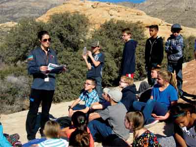 Ranger Mindy Grabko teaching Megan Moyer’s 5th grade class about map reading at Red Rock Canyon National Conservation Area. PHOTO BY MAGGIE MCMURRAY/Moapa Valley Progress.