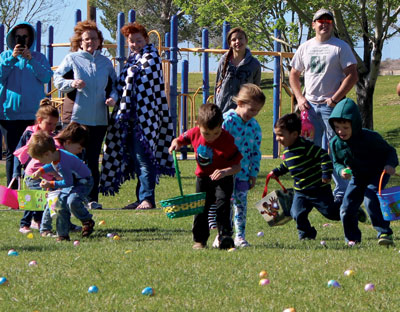 And they’re off!  The kids at the Moapa Egg Hunt last week scramble through the lawn at the park to gather as many eggs as possible. PHOTO BY MAGGIE MCMURRAY/Moapa Valley Progress.