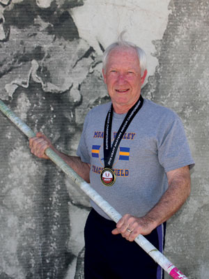 Connelly wears a medal that he won taking first place in his age division at the USATF Masters Indoor Track and Field meet.