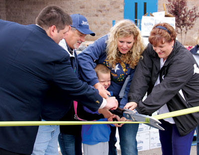 A ribbon cutting was held to begin the first Mobile Food Pantry event for the lower valley. Pictured l to r Kent Alexander of Congressman Cresent Hardy’s office, Assemblyman James Oscarson, Aidyn McClean, Bren McClean and Bowler principal Shawna Jessen. Hidden behind is Anita McClean.