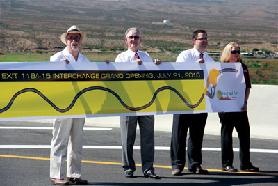 Holding the ribbon across Mesquite’s new exit 118 l to r Mayor Al Litman, MRB president George Gault, Bank of Nevada branch manager Dan Wright and Mesquite Do It Best general manager Wendy Kinney. PHOTO BY VERNON ROBISON/Moapa Valley Progress.