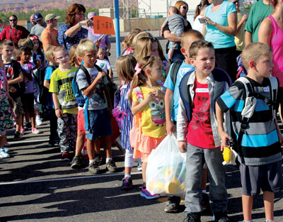Local kids line up on the playground of Grant Bowler Elementary School on Monday to await the beginning of a new school year. PHOTO BY MAGGIE MCMURRAY/Moapa Valley Progress.