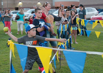 People lined up all evening for a chance to throw balls at a dunk tank provided by the MVHS Cross Country team at the All Sports Kickoff on Monday, August 29. PHOTO BY MACY MORGAN/Moapa Valley Progress.