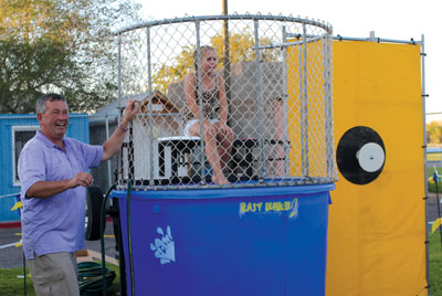 MVHS Cross Country coach Gary Watkins supervises the dunk tank at the All Sports Kickoff last week. PHOTO BY MAGGIE MCMURRAY/Moapa Valley Progress.