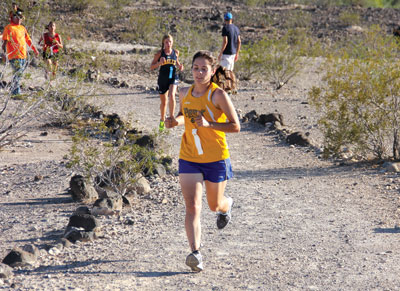 Pirate runner Matilda Thompson braves the afternoon heat in a 5K meet at SECTA last week. Thompson finished the girls race in 6th place. PHOTO BY VERNON ROBISON/Moapa Valley Progress.