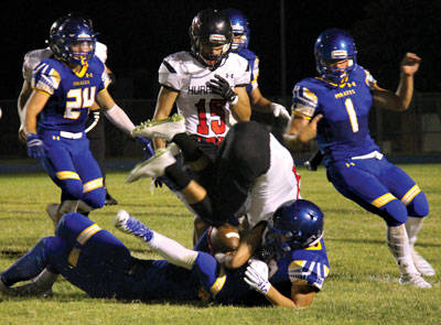 Pirate defenders bring down a Hurricane ball carrier in a home game played Friday night.  PHOTO COURTESY OF KIM HARDY.