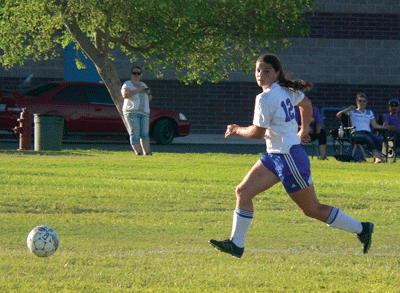 MVHS sophomore Lainey Cornwall takes possession of the ball during a home match against Rancho High School last week. PHOTO BY GANNON HANEVOLD/Moapa Valley Progress.