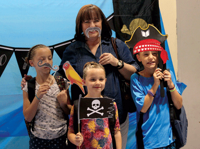 Brenda Myers with her grandchildren Faith, Zack and Hailey Kelly pose for silly photos during the Grandparents Day event at Grant Bowler Elementary last week. PHOTO BY MAGGIE MCMURRAY/Moapa Valley Progress.
