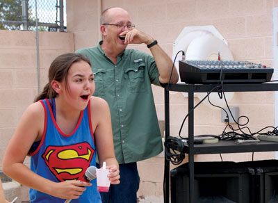 Lyon Student Body President Kyra Larsen and teacher Elwin Brown react to one of the many belly flop contest performances. Larsen was announcing the contest and Brown was acting as judge. PHOTO BY MAGGIE MCMURRAY/Moapa Valley Progress.