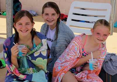Having a good time with friends. L to r Katrice Hull, Hannah Mayo and Alexa Canfield attend the Mack Lyon Back to School party last week. PHOTO BY MAGGIE MCMURRAY/Moapa Valley Progress.