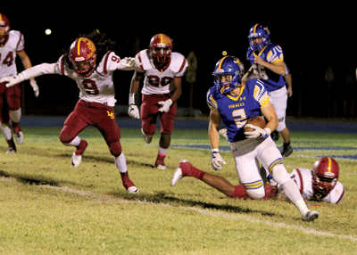 MVHS senior Jacob Leavitt runs the ball for the Pirates during a home game against Del Sol on Friday night. PHOTO BY VERNON ROBISON/Moapa Valley Progress.