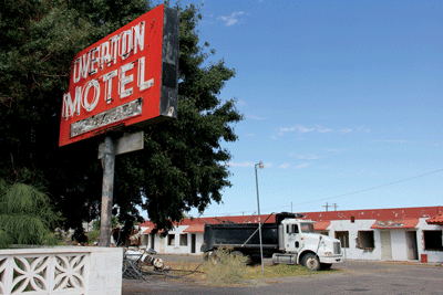 An icon of downtown Overton disappeared last week. Work crews knocked down the Overton Motel structures and hauled away the debris from the 70 year old buildings. PHOTO BY VERNON ROBISON/Moapa Valley Progress.